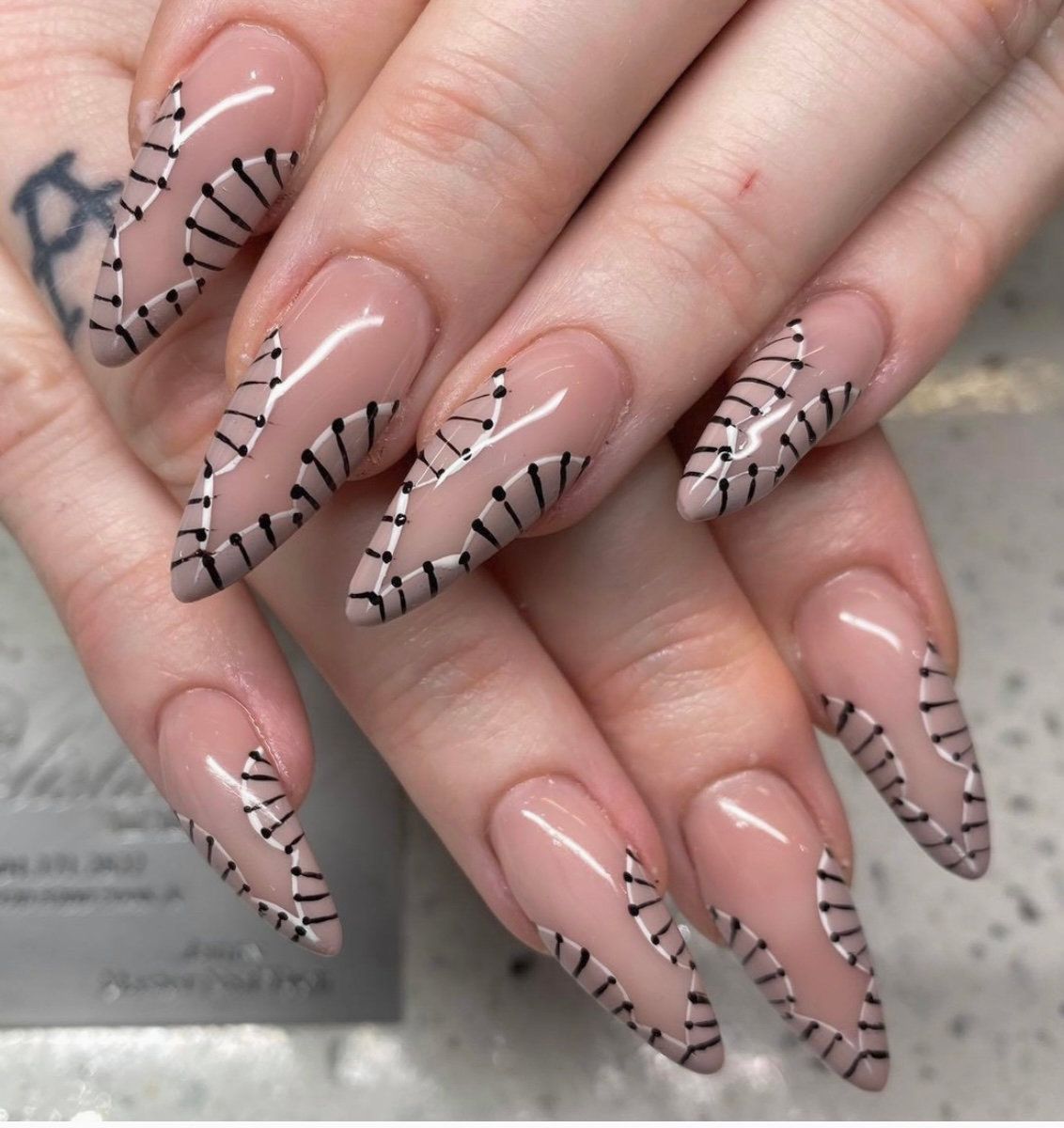 Nude nails with fine black line art