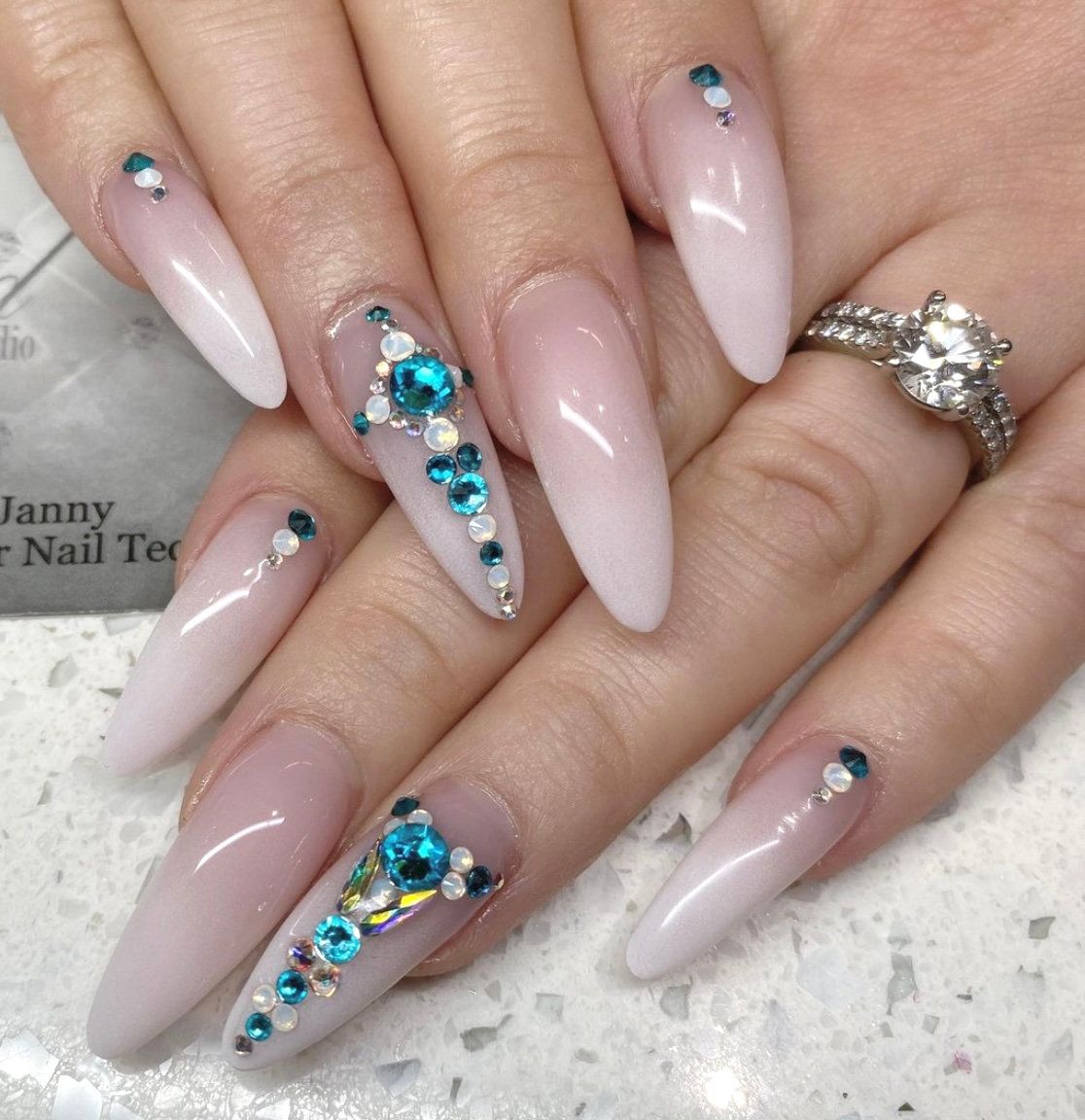 Nude nails with crystal accents